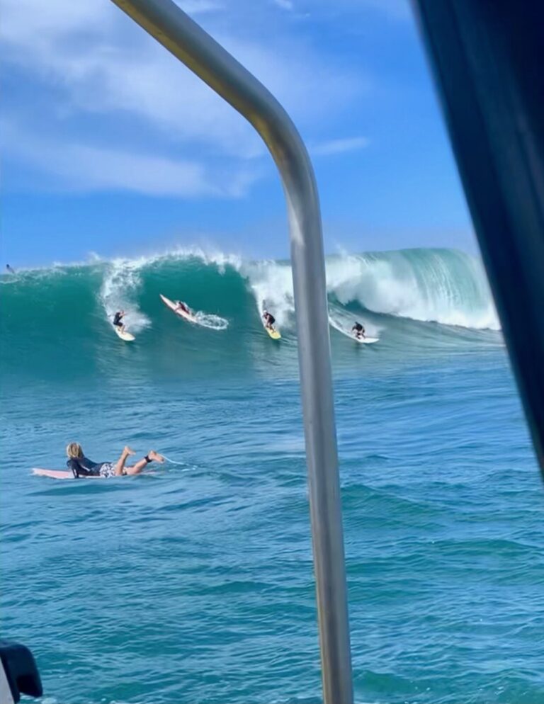 Surfers catching waves North Shore Big Wave Adventure Tour